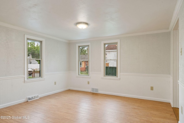 16 Smith Ln, East Greenbush, NY 12144 - unfurnished room with light wood finished floors, ornamental molding, and a wainscoted wall