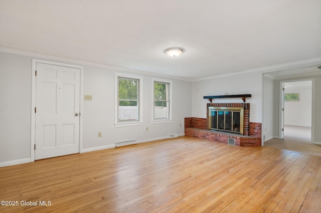 16 Smith Ln, East Greenbush, NY 12144 - unfurnished living room with light wood-style flooring, healthy amount of natural light, a baseboard heating unit, a fireplace, and ornamental molding