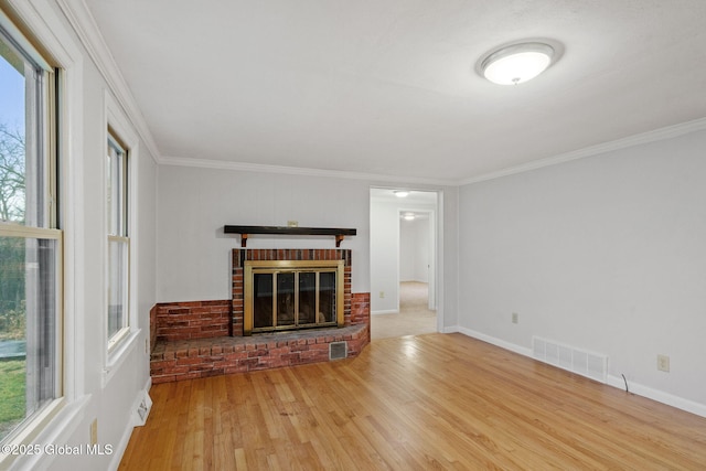 16 Smith Ln, East Greenbush, NY 12144 - unfurnished living room featuring wood finished floors, a fireplace, crown molding, and baseboards
