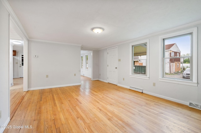 16 Smith Ln, East Greenbush, NY 12144 - spare room featuring crown molding, healthy amount of natural light, light wood-style flooring, and baseboards