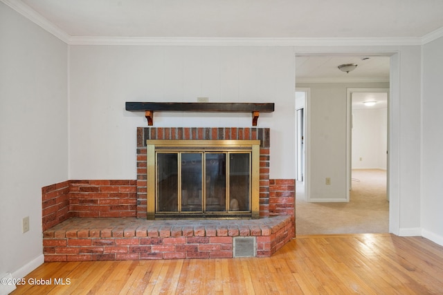 16 Smith Ln, East Greenbush, NY 12144 - detailed view of a fireplace, wood finished floors, ornamental molding, and baseboards