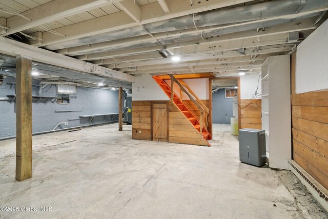 16 Smith Ln, East Greenbush, NY 12144 - unfinished basement with a baseboard heating unit and stairway