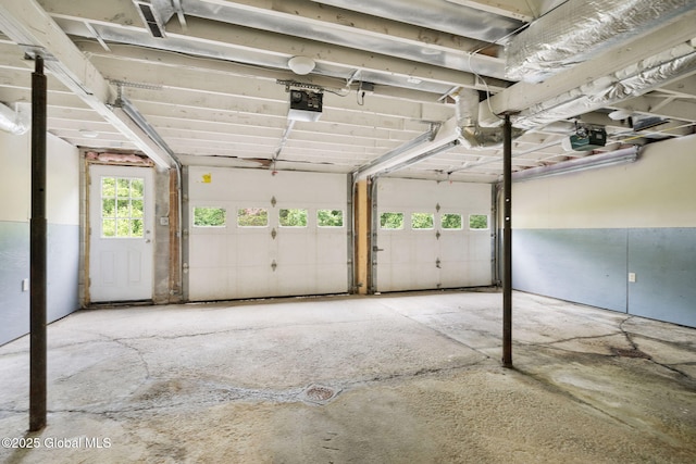 16 Smith Ln, East Greenbush, NY 12144 - garage featuring a garage door opener
