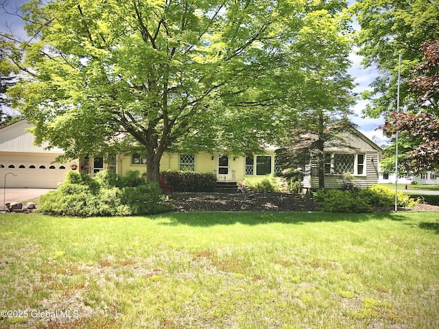 607 Gansevoort Rd, Moreau, NY 12803 - obstructed view of property with an attached garage, a front yard, and driveway