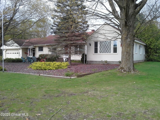 607 Gansevoort Rd, Moreau, NY 12803 - view of front of house featuring a front lawn, an attached garage, and a chimney