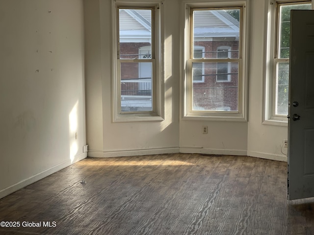869 Strong St, Schenectady, NY 12307 - empty room featuring healthy amount of natural light, wood finished floors, and baseboards