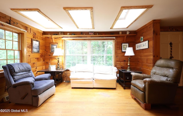68 Elks Glade Rd, Chester, NY 12817 - living room featuring light wood-type flooring and wooden walls