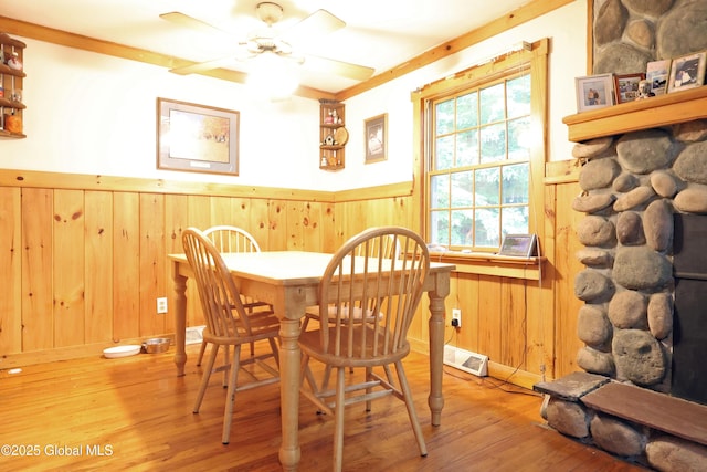 68 Elks Glade Rd, Chester, NY 12817 - dining space featuring a wainscoted wall, hardwood / wood-style floors, ceiling fan, and wood walls