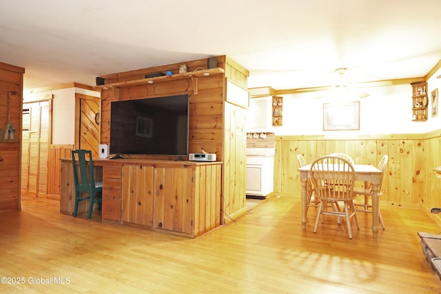 68 Elks Glade Rd, Chester, NY 12817 - living room featuring a wainscoted wall, wood finished floors, a ceiling fan, and wood walls