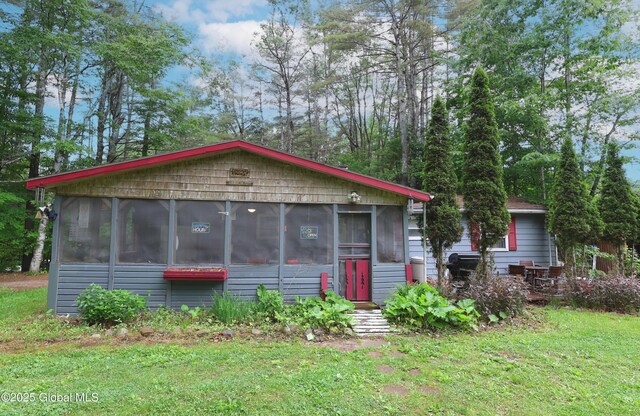68 Elks Glade Rd, Chester, NY 12817 - view of front of house with a sunroom and a front lawn