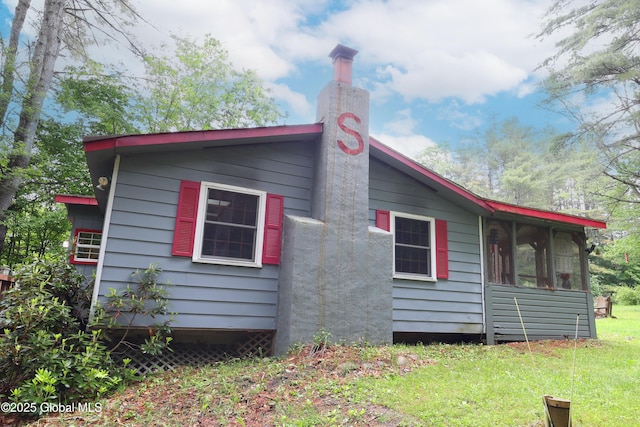 68 Elks Glade Rd, Chester, NY 12817 - view of side of property featuring a yard and a sunroom