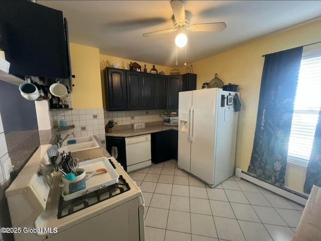 13 Hawk St, Amsterdam, NY 12010 - kitchen featuring white appliances, a baseboard heating unit, a sink, and healthy amount of natural light
