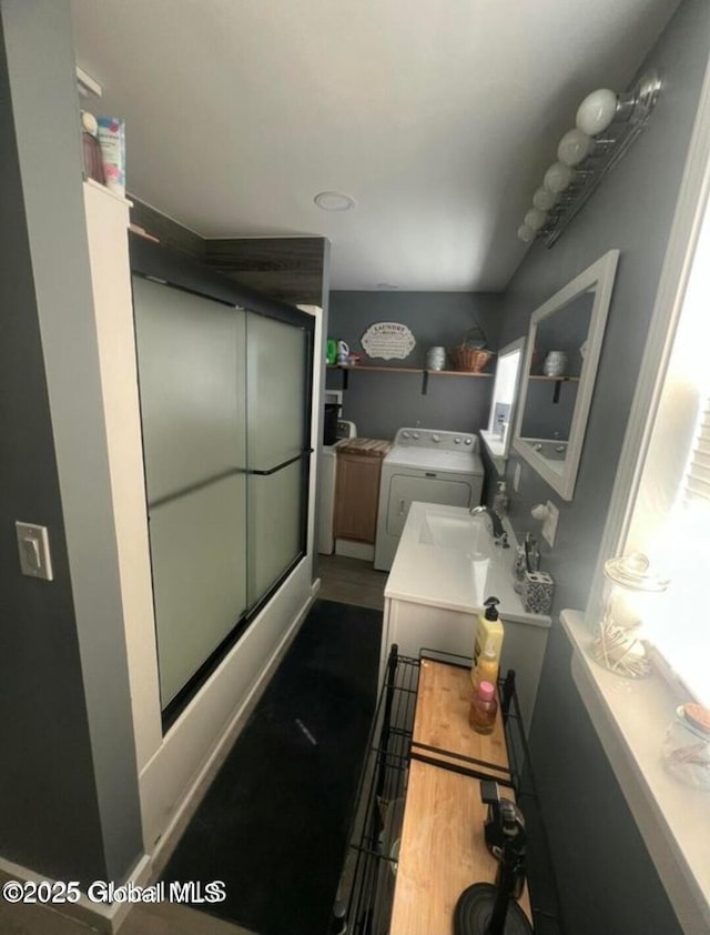 13 Hawk St, Amsterdam, NY 12010 - full bath featuring a shower stall, vanity, washing machine and dryer, and wood finished floors