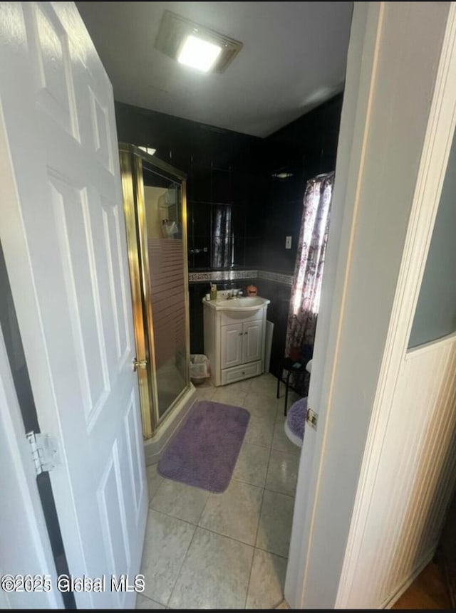 13 Hawk St, Amsterdam, NY 12010 - full bath featuring a stall shower, vanity, and tile patterned floors