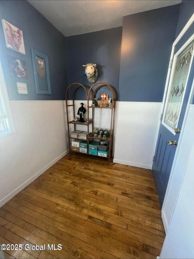 13 Hawk St, Amsterdam, NY 12010 - corridor featuring wainscoting and wood-type flooring