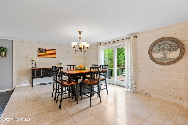 1396 Barton Hill Rd, Wright, NY 12053 - dining space with a chandelier, wood walls, and baseboards