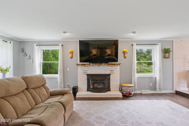 1396 Barton Hill Rd, Wright, NY 12053 - living area with ornamental molding, wood finished floors, baseboards, and a brick fireplace