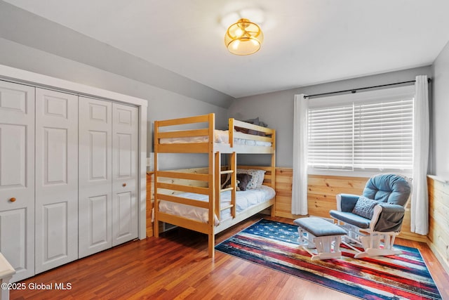 1396 Barton Hill Rd, Wright, NY 12053 - bedroom with wood finished floors, vaulted ceiling, a closet, and wooden walls