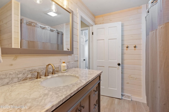 1396 Barton Hill Rd, Wright, NY 12053 - bathroom featuring vanity, wood finished floors, and a shower with shower curtain