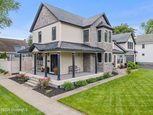 195 W Circular St, Saratoga Springs, NY 12866 - victorian-style house with a standing seam roof, covered porch, stone siding, a metal roof, and asphalt driveway