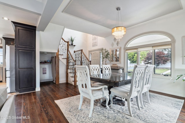 195 W Circular St, Saratoga Springs, NY 12866 - dining area with dark wood-style flooring, stairs, a chandelier, and a tray ceiling