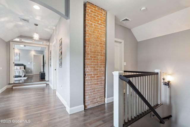 195 W Circular St, Saratoga Springs, NY 12866 - corridor featuring an upstairs landing, lofted ceiling, and wood finished floors