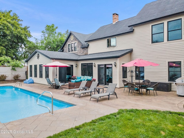 195 W Circular St, Saratoga Springs, NY 12866 - back of property featuring an outdoor hangout area, a patio, and a chimney