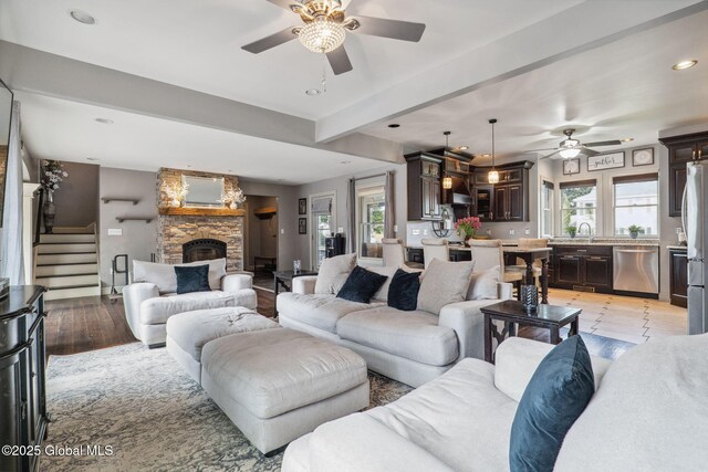 195 W Circular St, Saratoga Springs, NY 12866 - living room featuring ceiling fan, a stone fireplace, stairway, and recessed lighting