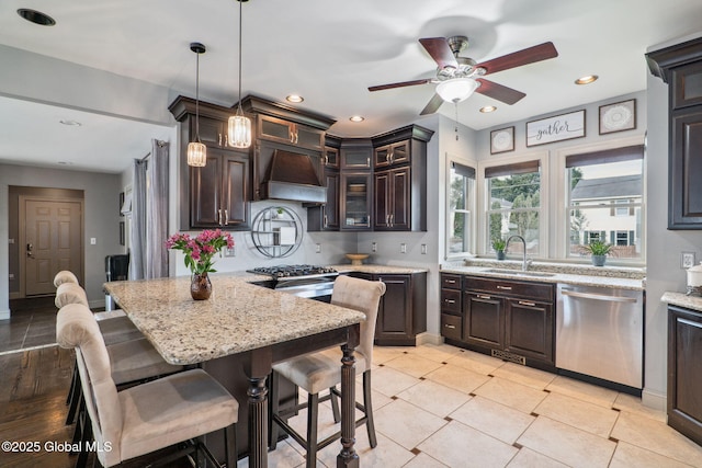 195 W Circular St, Saratoga Springs, NY 12866 - kitchen featuring dishwasher, premium range hood, ceiling fan, recessed lighting, and dark brown cabinets