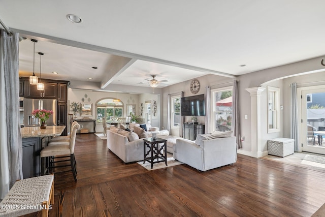 195 W Circular St, Saratoga Springs, NY 12866 - living area featuring dark wood-style floors, arched walkways, recessed lighting, decorative columns, and a ceiling fan