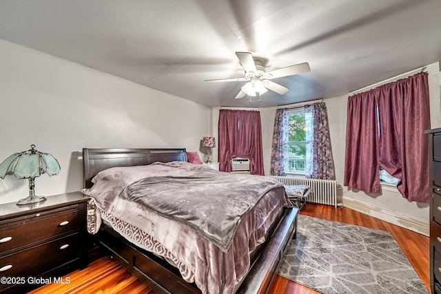58 N Allen St, Albany, NY 12203 - bedroom with radiator, wood finished floors, a ceiling fan, and baseboards
