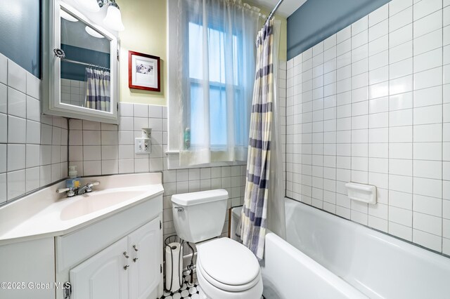 58 N Allen St, Albany, NY 12203 - full bath with tile walls, vanity, shower / bath combination with curtain, and toilet