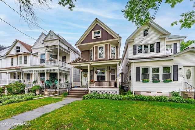 58 N Allen St, Albany, NY 12203 - victorian-style house with a porch, a front yard, and crawl space