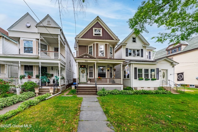 58 N Allen St, Albany, NY 12203 - victorian-style house featuring covered porch, a front lawn, and crawl space