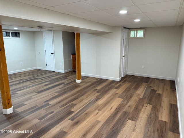 311 Old Loudon Rd, Colonie, NY 12110 - below grade area with dark wood-style flooring, baseboards, recessed lighting, and a drop ceiling