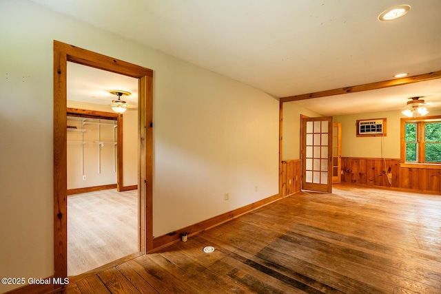904 Ashgrove Rd, White Creek, NY 12816 - spare room with hardwood / wood-style floors, a wainscoted wall, a ceiling fan, wood walls, and recessed lighting