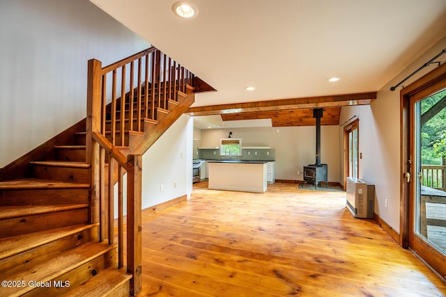 904 Ashgrove Rd, White Creek, NY 12816 - stairway with a wood stove, wood-type flooring, recessed lighting, and baseboards