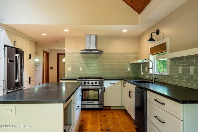 904 Ashgrove Rd, White Creek, NY 12816 - kitchen featuring appliances with stainless steel finishes, wall chimney exhaust hood, a sink, dark countertops, and recessed lighting