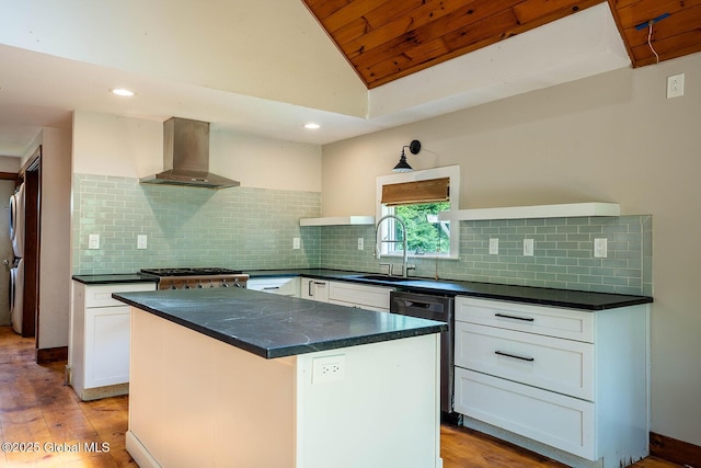 904 Ashgrove Rd, White Creek, NY 12816 - kitchen featuring wall chimney range hood, a sink, vaulted ceiling, light wood finished floors, and dark countertops