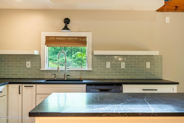 904 Ashgrove Rd, White Creek, NY 12816 - kitchen with a sink, dishwashing machine, dark countertops, white cabinets, and decorative backsplash