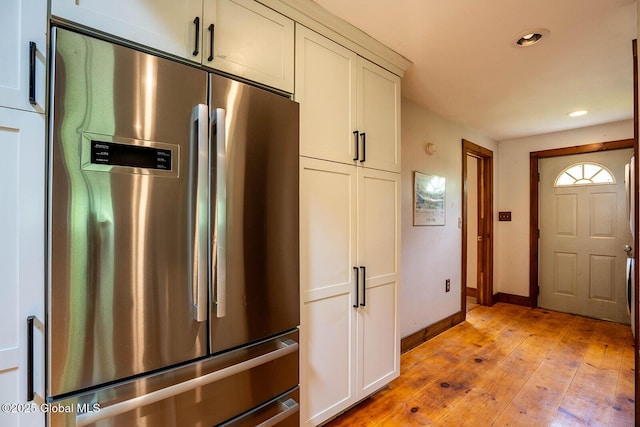 904 Ashgrove Rd, White Creek, NY 12816 - kitchen with freestanding refrigerator, light wood finished floors, recessed lighting, baseboards, and white cabinets