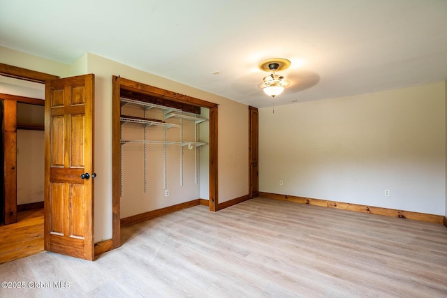 904 Ashgrove Rd, White Creek, NY 12816 - unfurnished bedroom featuring light wood finished floors, a closet, and baseboards