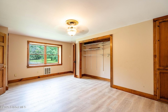 904 Ashgrove Rd, White Creek, NY 12816 - unfurnished bedroom with light wood-type flooring, a closet, and baseboards