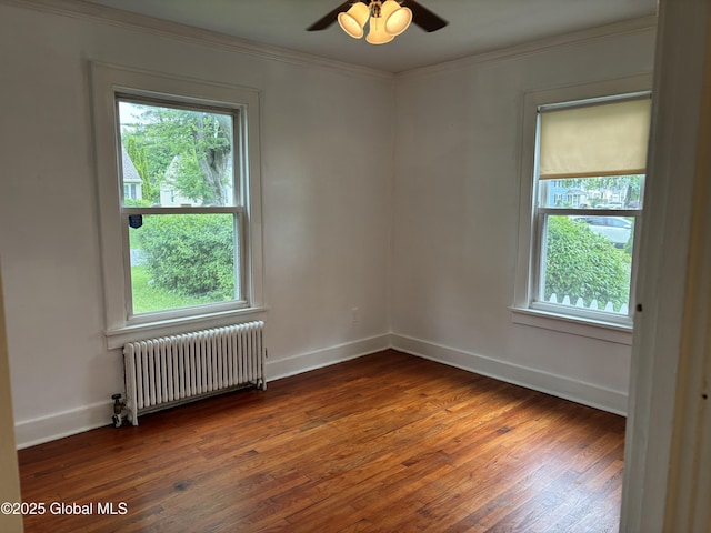 1922 Regent St, Niskayuna, NY 12309 - spare room featuring radiator heating unit, hardwood / wood-style floors, a ceiling fan, and ornamental molding