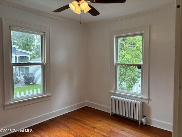 1922 Regent St, Niskayuna, NY 12309 - unfurnished room with radiator, healthy amount of natural light, wood finished floors, ornamental molding, and a ceiling fan