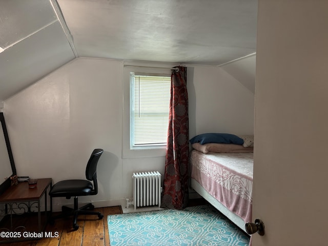 1922 Regent St, Niskayuna, NY 12309 - bedroom featuring radiator, vaulted ceiling, and wood finished floors