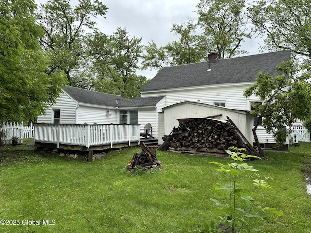 1922 Regent St, Niskayuna, NY 12309 - rear view of house featuring a deck, a chimney, and roof with shingles