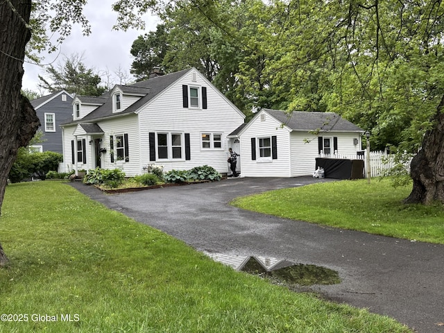1922 Regent St, Niskayuna, NY 12309 - new england style home featuring a chimney and asphalt driveway