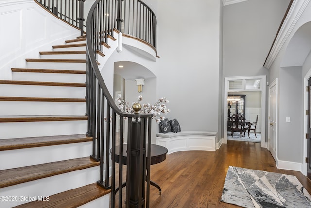 1 Stoneridge Dr, Colonie, NY 12211 - foyer entrance featuring stairs, wood finished floors, a high ceiling, a wainscoted wall, and a chandelier