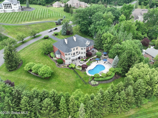 1 Stoneridge Dr, Colonie, NY 12211 - drone / aerial view of a pool area and a tree filled landscape